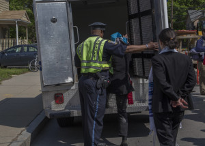 Getting into the police van, with Shoshana next in line (photo credit: Robert A. Jonas)