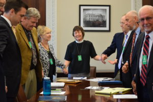 Margaret prays at the end of a meeting with members of National Religious Coalition on Creation Care and of White House Council on Environmental Quality. Photo credit: Beautifell Photography by Christine Ellman