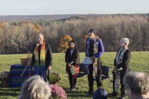 Fred Small leads singing, with Christina Leano, Bishop Jim Hazelwood, and MACUCC Conference Minister Jim Antal. Photo credit: Robert A. Jonas