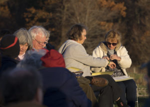 Tying green ribbons to each others' wrists as a sign of our commitment. Photo credit: Robert A. Jonas