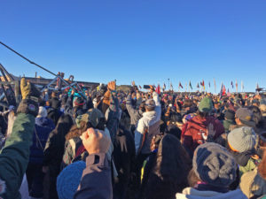 Rejoicing at the sacred fire. Photo credit: Michael Arase-Barham