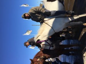 Young men on horseback assembling as they prepare to lead the way in rebuilding the Sacred Hoop